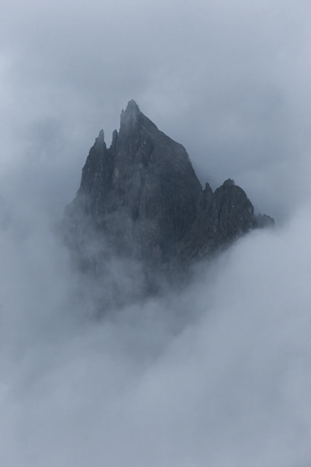 Peak of Cimon di Croda Liscia appearing through cloud